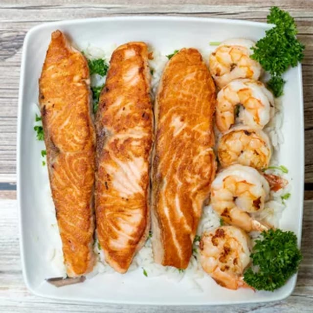 Grilled Salmon & Shrimp Over Rice.